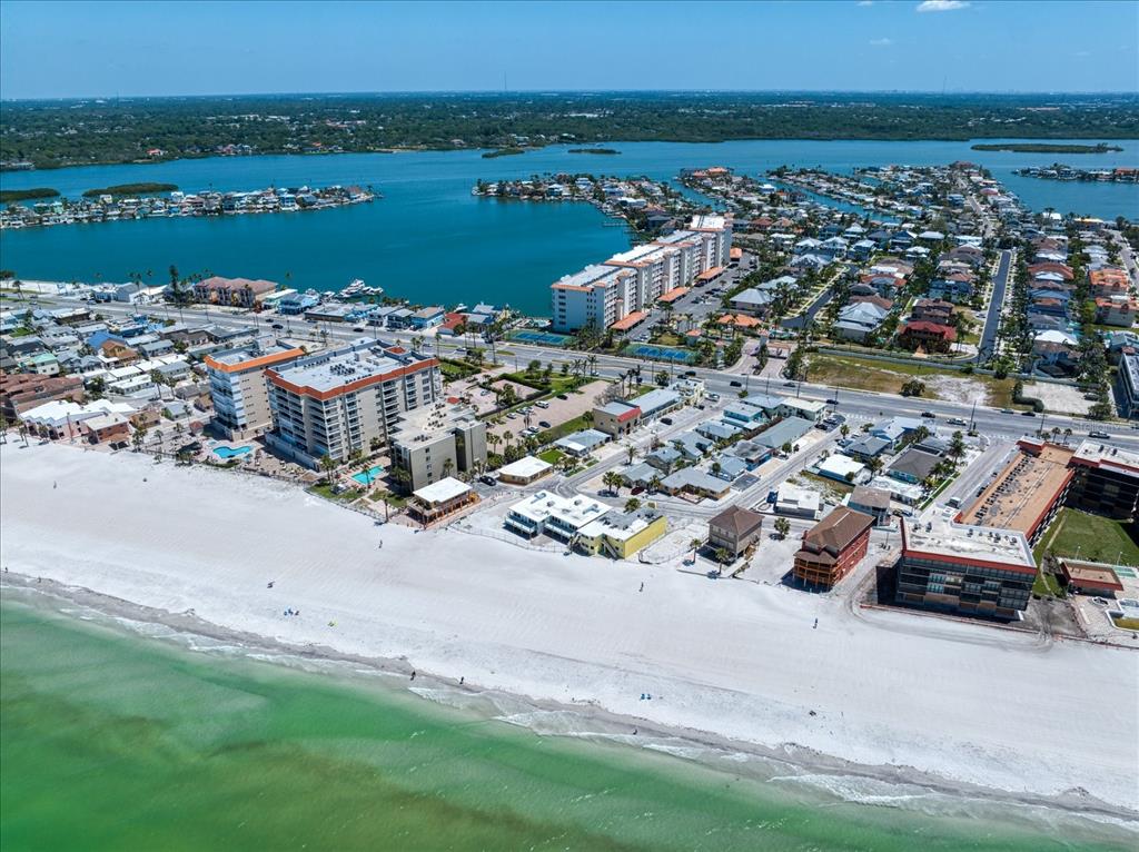 17735 Gulf Boulevard, Unit 304 Redington Shores, FL 33708 - Photo 4 of 66 an aerial view of a city with ocean view