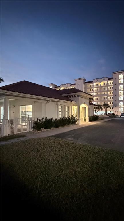 17735 Gulf Boulevard, Unit 304 Redington Shores, FL 33708 - Photo 43 of 66 a view of a big house with a big yard next to a road