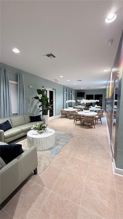 17735 Gulf Boulevard, Unit 304 Redington Shores, FL 33708 - Photo 47 of 66 a living room with furniture and a table