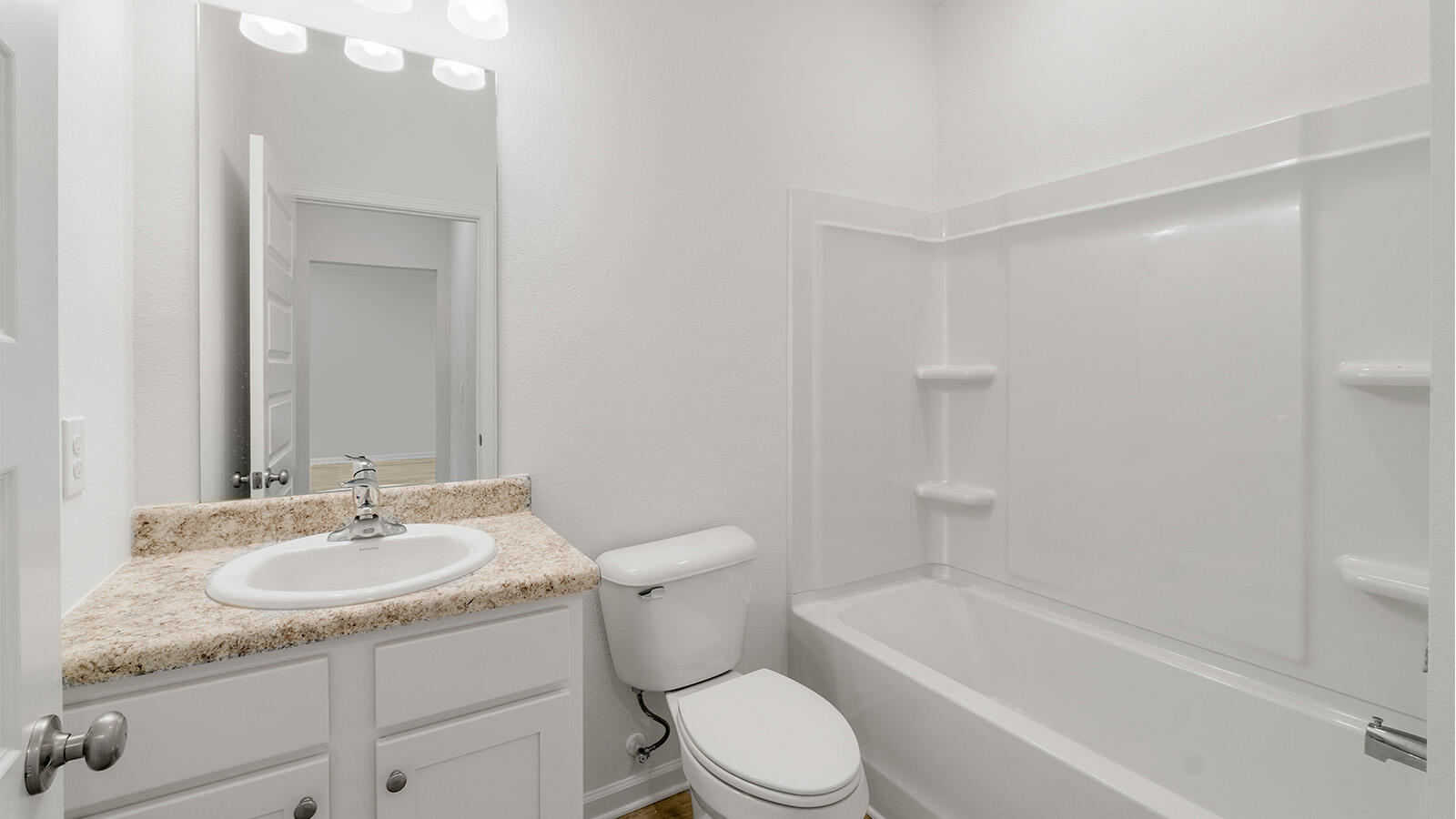 52 Elderberry Street Freeport, FL 32439 - Photo 18 of 36 a bathroom with a sink toilet vanity and tub