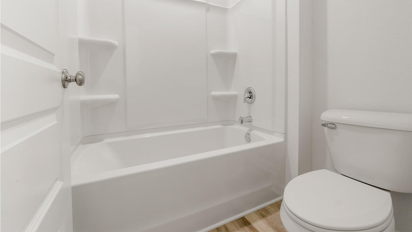 52 Elderberry Street Freeport, FL 32439 - Photo 19 of 36 a white toilet sitting next to a bath tub