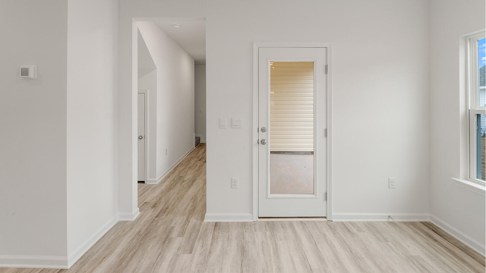 52 Elderberry Street Freeport, FL 32439 - Photo 24 of 36 a view of a hallway with wooden floor and staircase