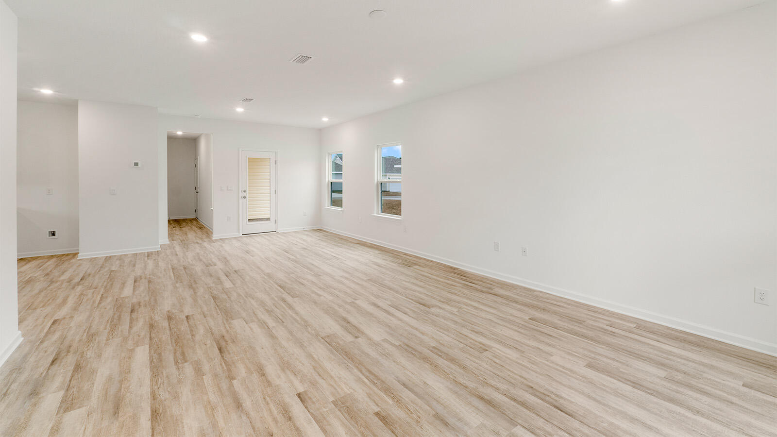 52 Elderberry Street Freeport, FL 32439 - Photo 3 of 36 a view of an empty room with wooden floor and a window