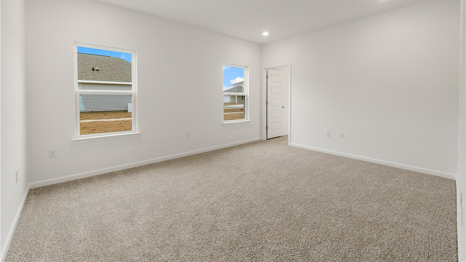 52 Elderberry Street Freeport, FL 32439 - Photo 8 of 36 an empty room with a window and a mirror