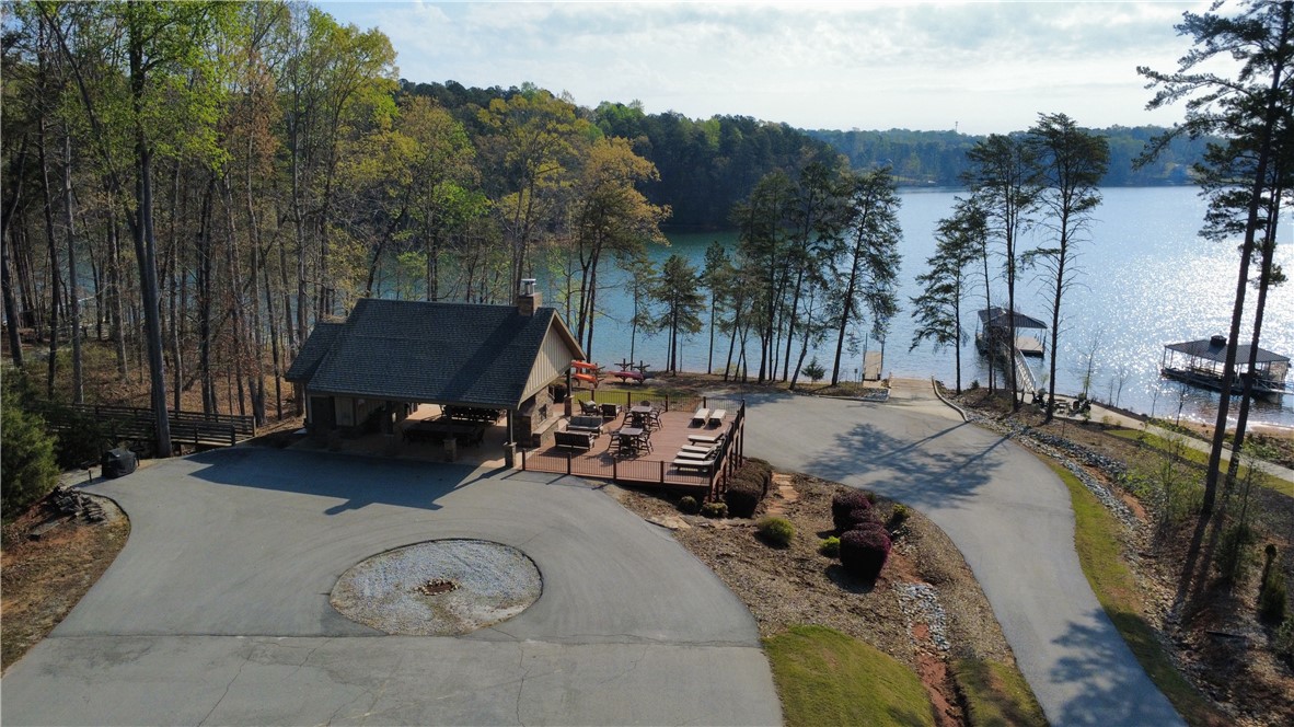 128 McAlister Road West Union, SC 29696 - Photo 32 of 40 A charming lakeside retreat featuring a well-appointed outdoor pavilion and ample recreation opportunities.