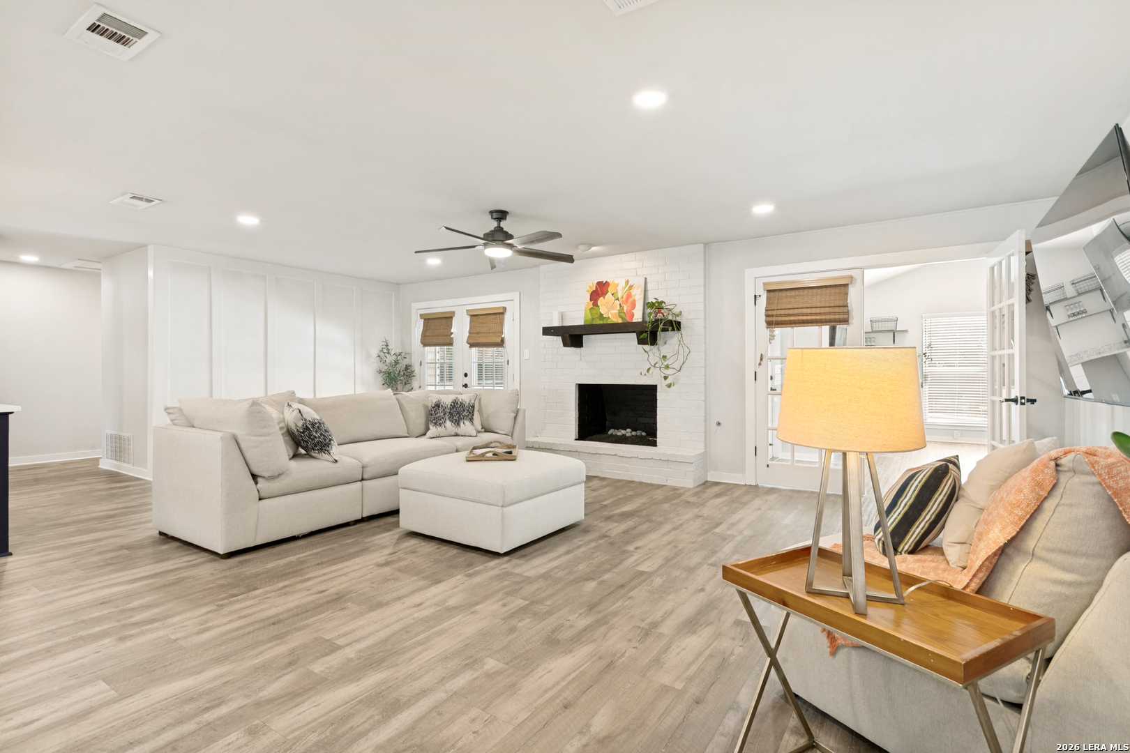 102 Silver Spring Universal City, TX 78148 - Photo 7 of 36 a living room with furniture and a fireplace