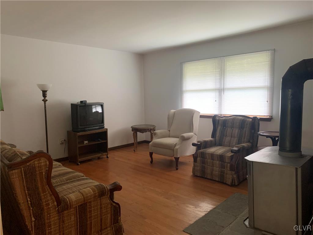 343 Haney Road Kunkletown, PA 18058 - Photo 7 of 27 a living room with furniture a flat screen tv and a window