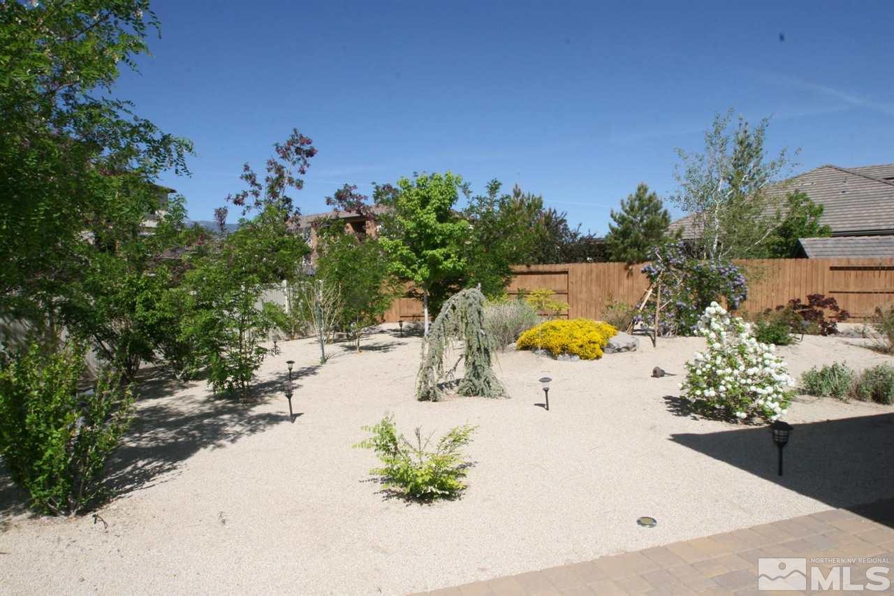 2098 Blue Boy Lane Reno, NV 89521 - Photo 25 of 26 a view of a swimming pool with a yard