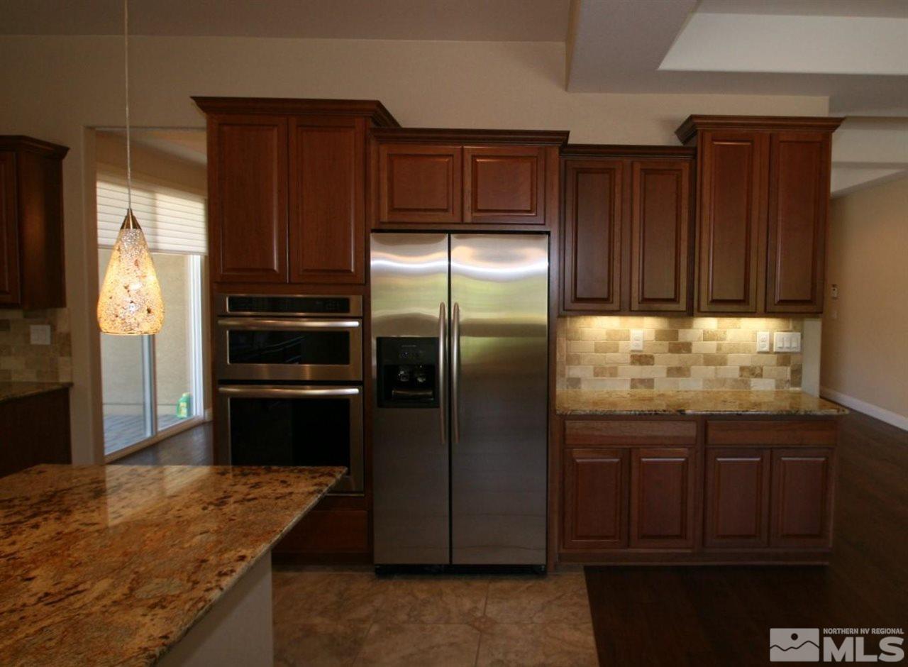 2098 Blue Boy Lane Reno, NV 89521 - Photo 6 of 26 a kitchen with a refrigerator and a sink