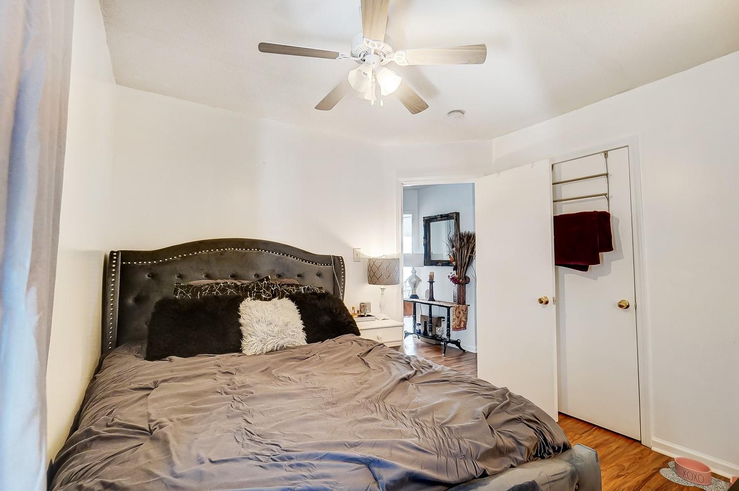 2010 Pimpernel Road Charlotte, NC 28213 - Photo 29 of 45 a bedroom with a bed and a chandelier
