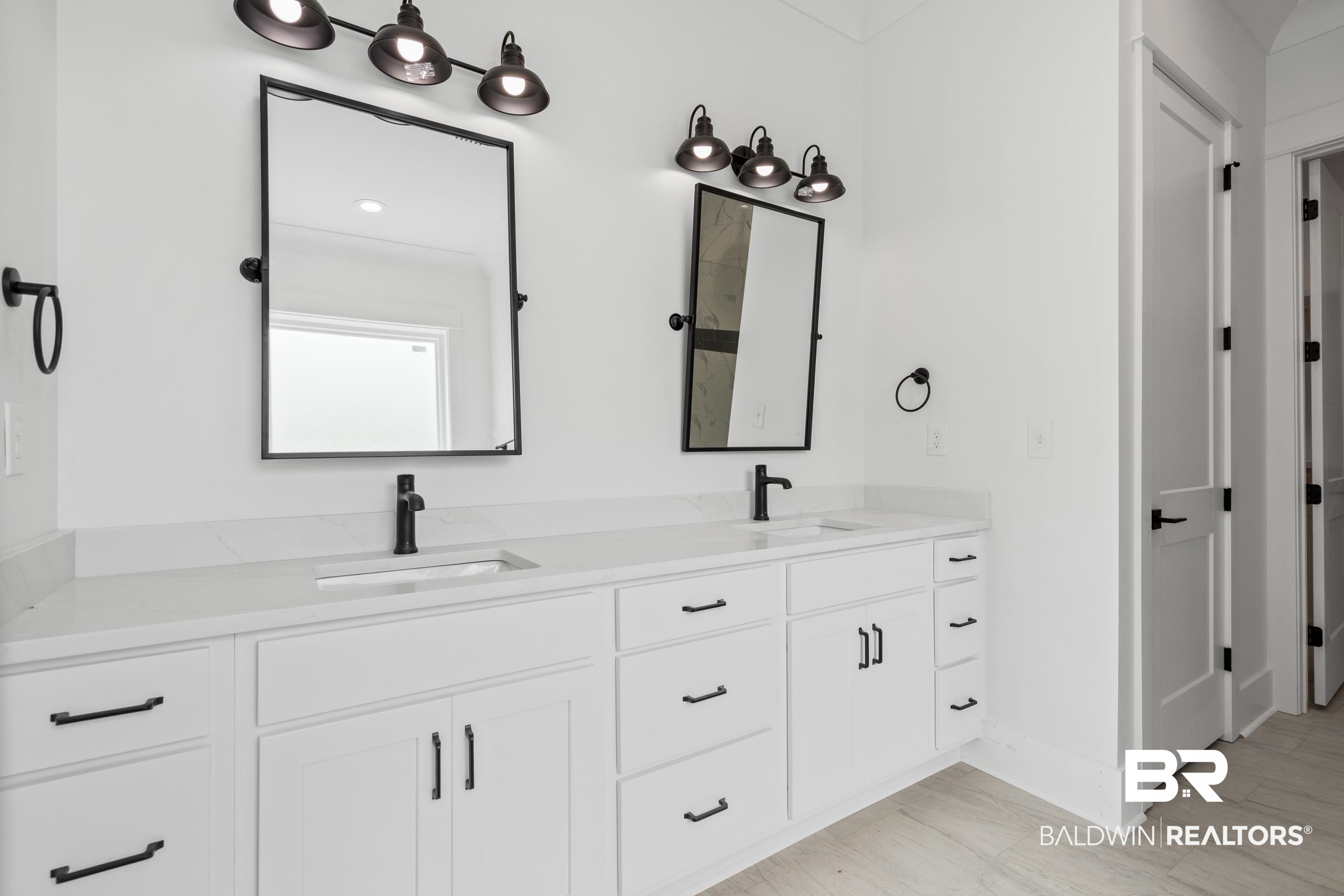 30650 Ono N Loop West Orange Beach, AL 36561 - Photo 17 of 38 Full bathroom featuring double vanity and baseboards