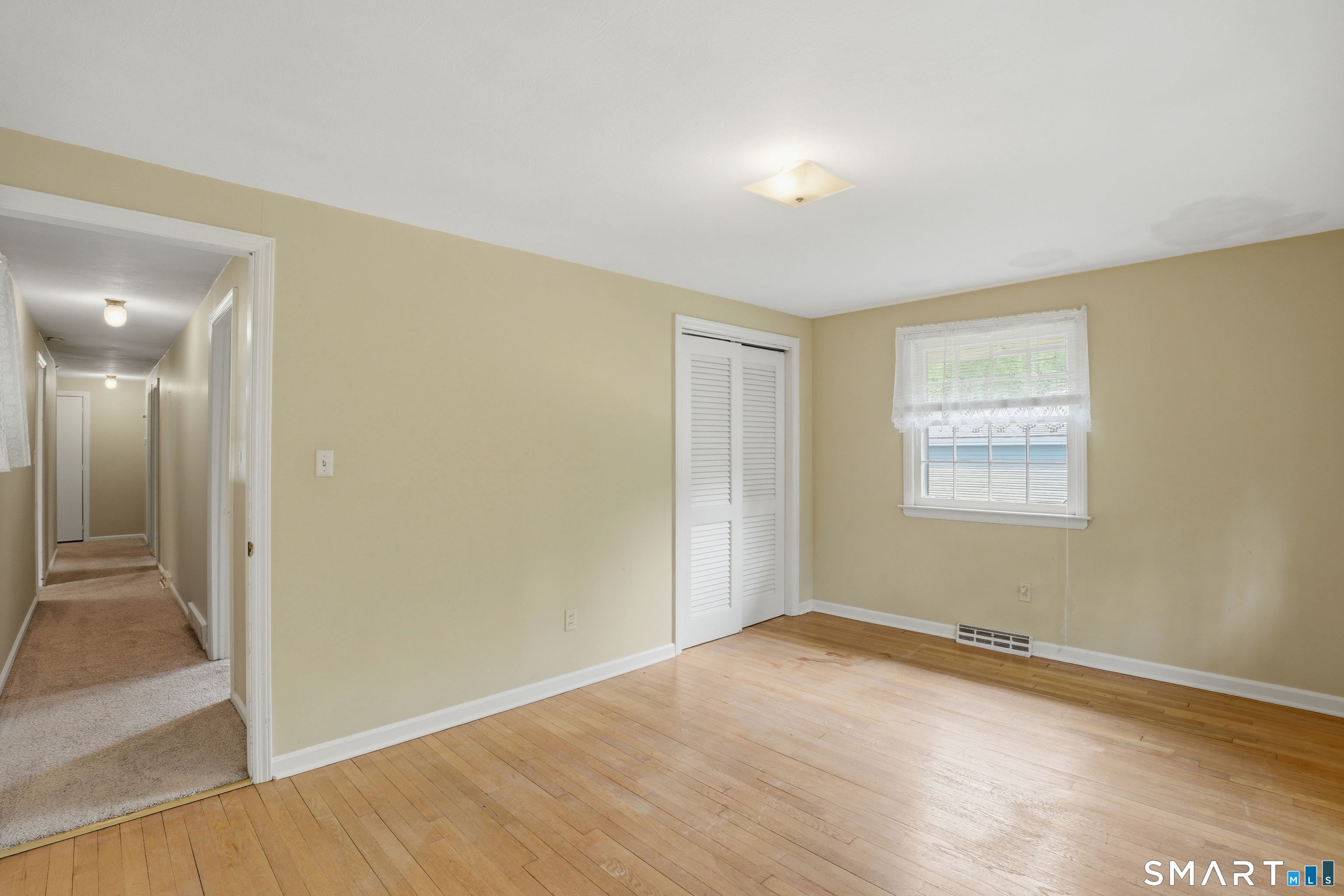731 Still Hill Road Hamden, CT 06518 - Photo 16 of 40 an empty room with wooden floor and windows