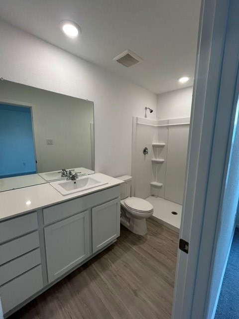 913 Pertuso Lane Huffman, TX 77336 - Photo 12 of 36 a bathroom with a double vanity sink toilet and shower