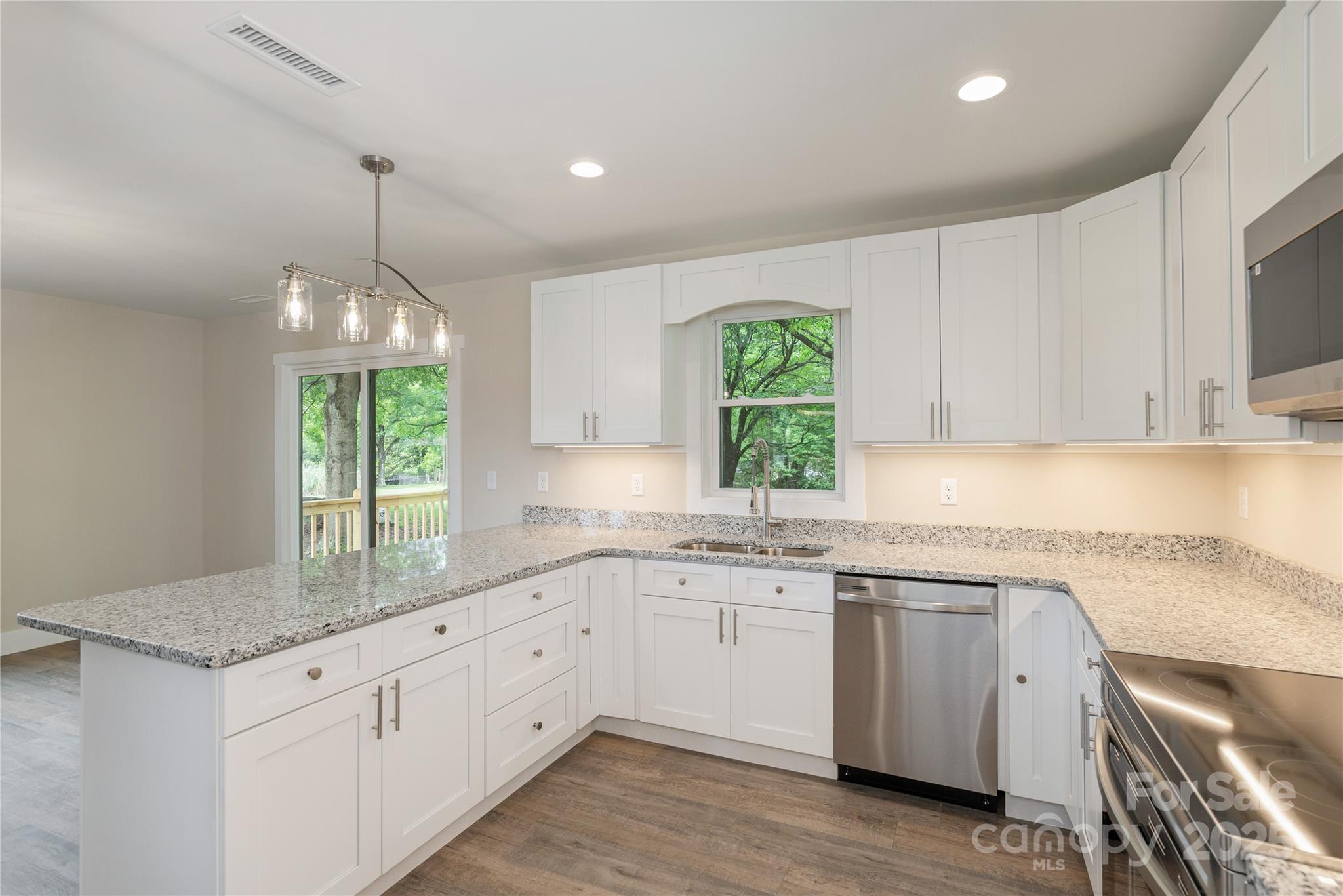 782 Poors Ford Road Rutherfordton, NC 28139 - Photo 11 of 25 a kitchen that has a sink and a stove in it