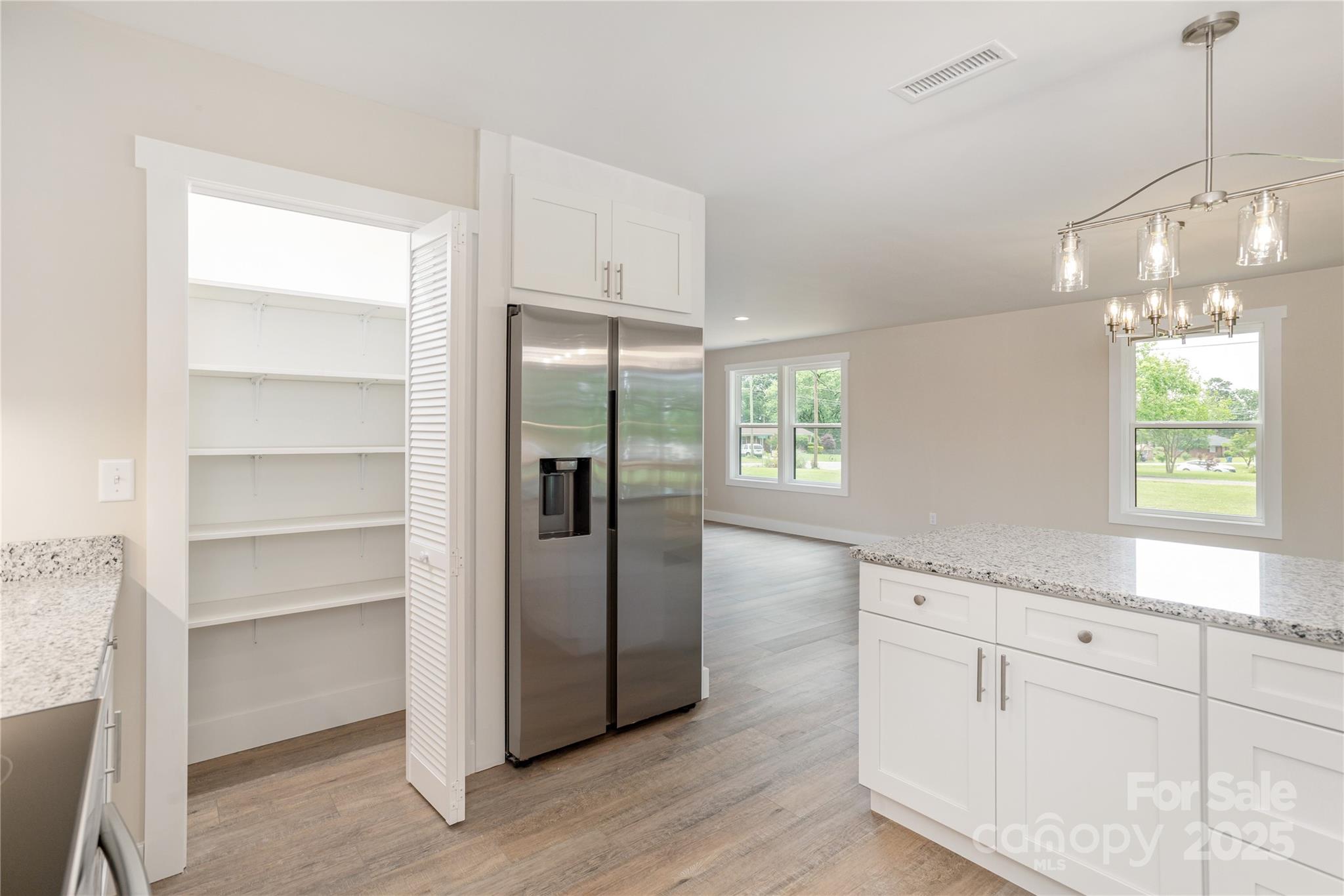 782 Poors Ford Road Rutherfordton, NC 28139 - Photo 13 of 25 a kitchen with white cabinets and window