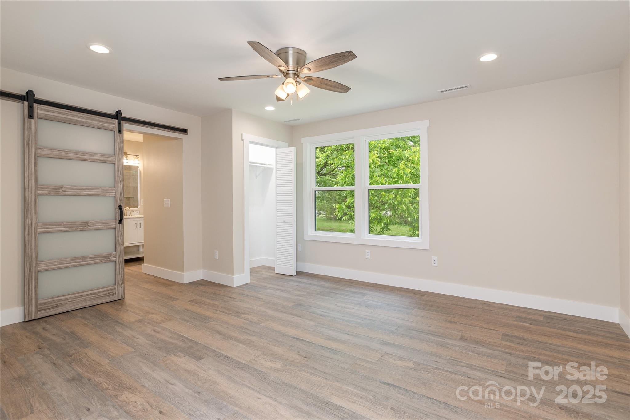 782 Poors Ford Road Rutherfordton, NC 28139 - Photo 14 of 25 wooden floor in an empty room with a window