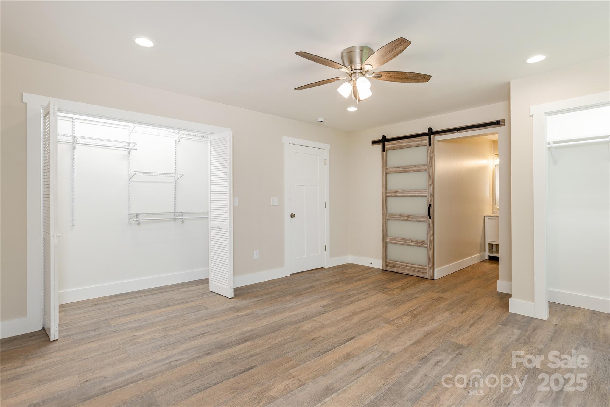 782 Poors Ford Road Rutherfordton, NC 28139 - Photo 15 of 25 an empty room with wooden floor and closet area