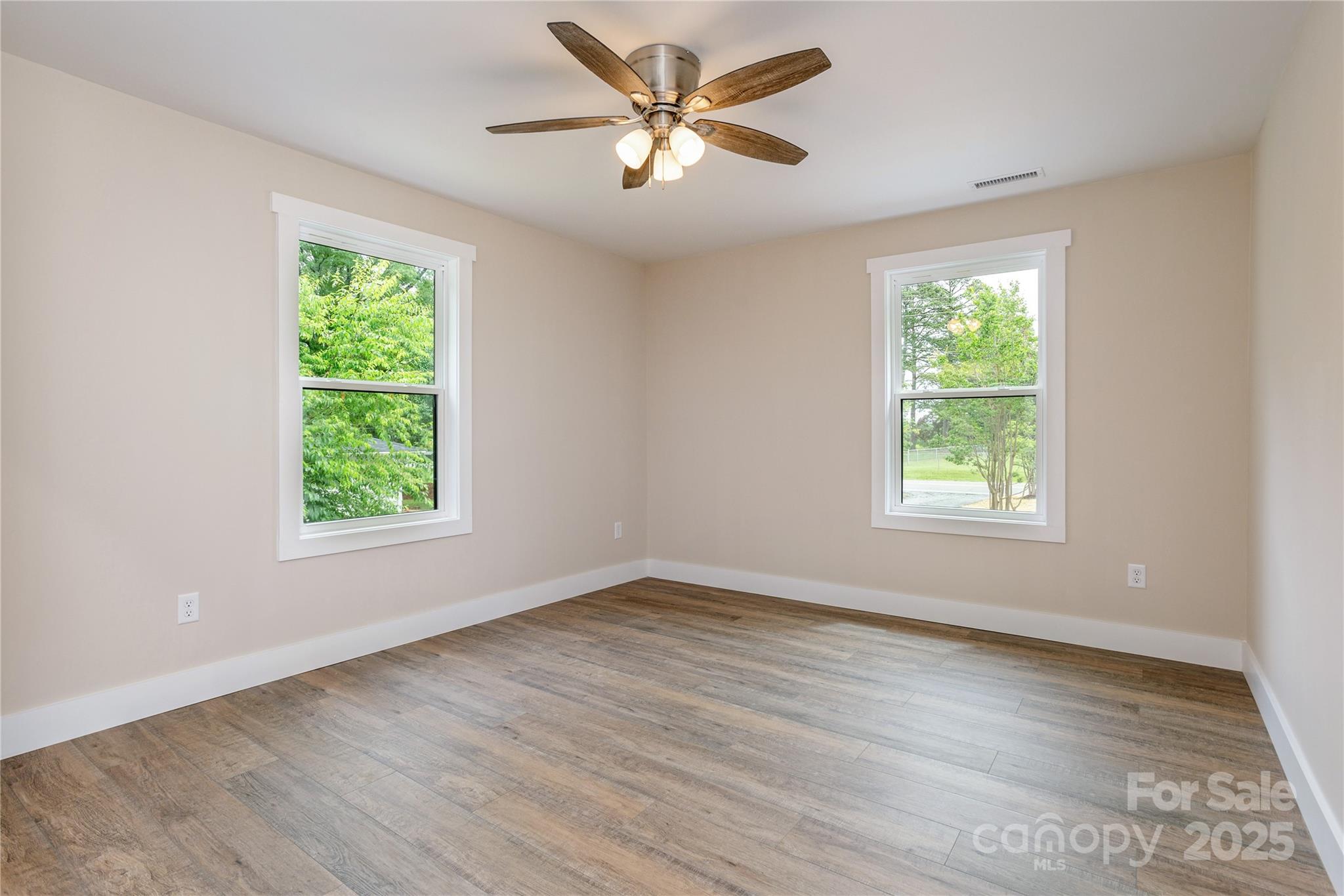 782 Poors Ford Road Rutherfordton, NC 28139 - Photo 18 of 25 an empty room with wooden floor and windows