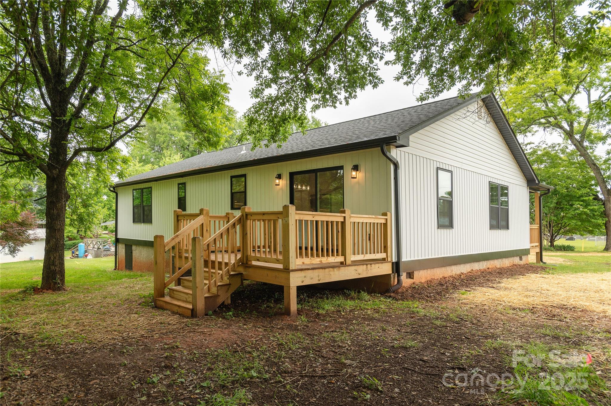 782 Poors Ford Road Rutherfordton, NC 28139 - Photo 24 of 25 a view of a house with a yard chairs and a big yard