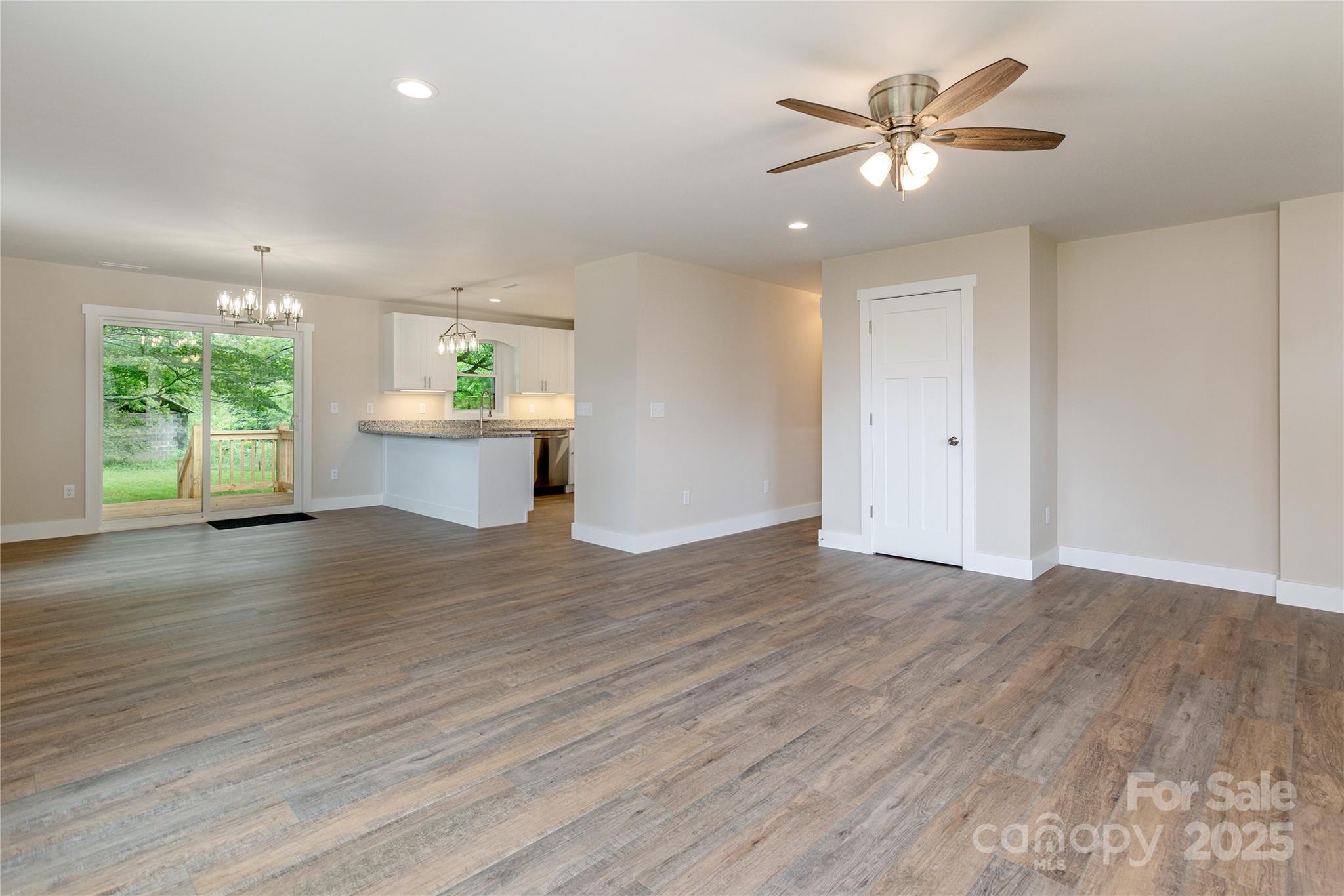 782 Poors Ford Road Rutherfordton, NC 28139 - Photo 6 of 25 an empty room with wooden floor and window