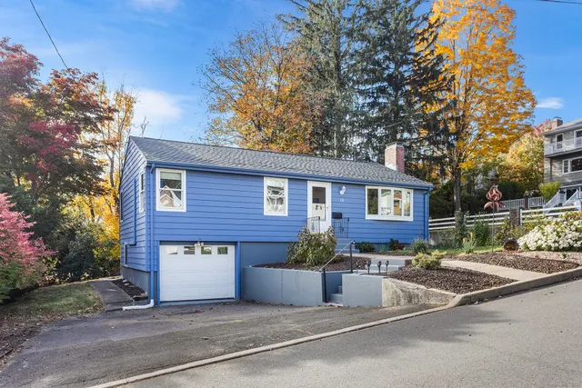 a view of house with outdoor space and street view