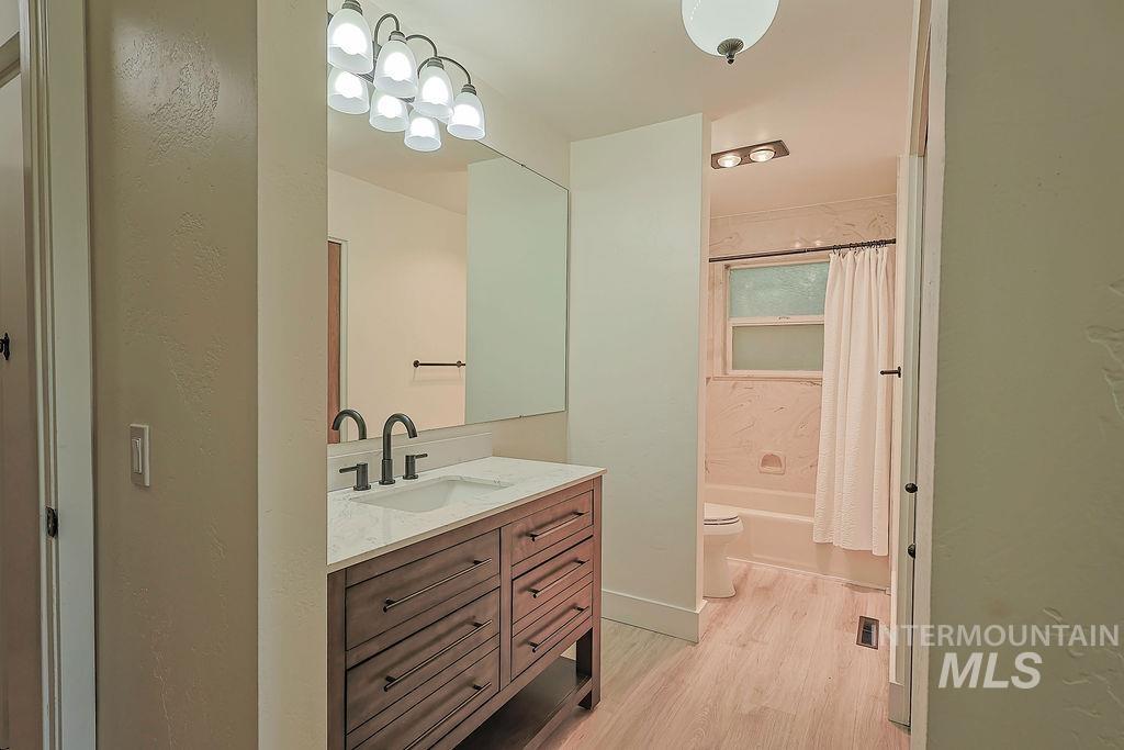 640 Morrison Street Twin Falls, ID 83301 - Photo 20 of 30 Bathroom vanity featuring a quartz countertop with an integrated sink and matte black fixtures