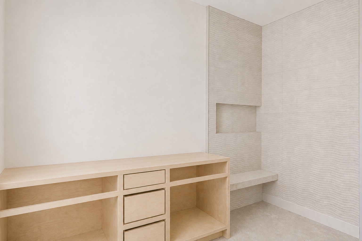 4603 Bucks Run Austin, TX 78744 - Photo 12 of 14 Built-in light wood cabinetry with open shelving and drawers, complemented by textured wall paneling featuring a recessed niche and integrated bench seating