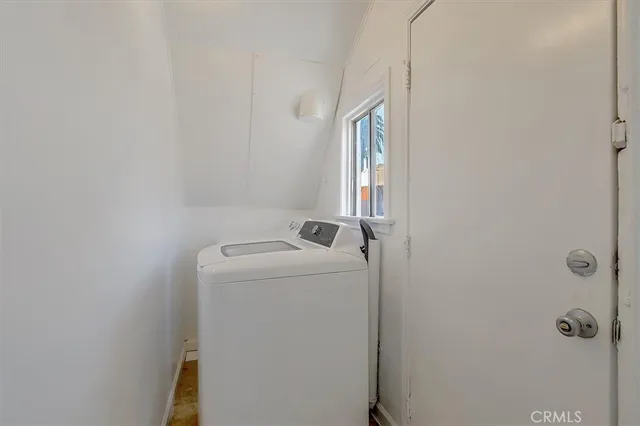 an outdoor space with furniture and umbrella