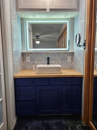 a bathroom with a sink and a mirror