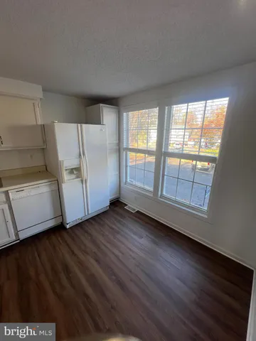 a view of a livingroom with wooden floor