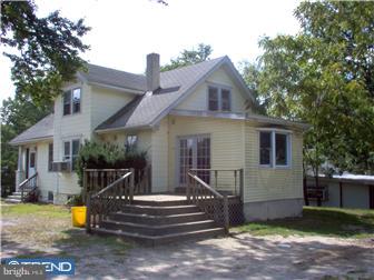 587 Berlin Road Clementon, NJ 08021 - Photo 1 of 1 a view of a house with backyard