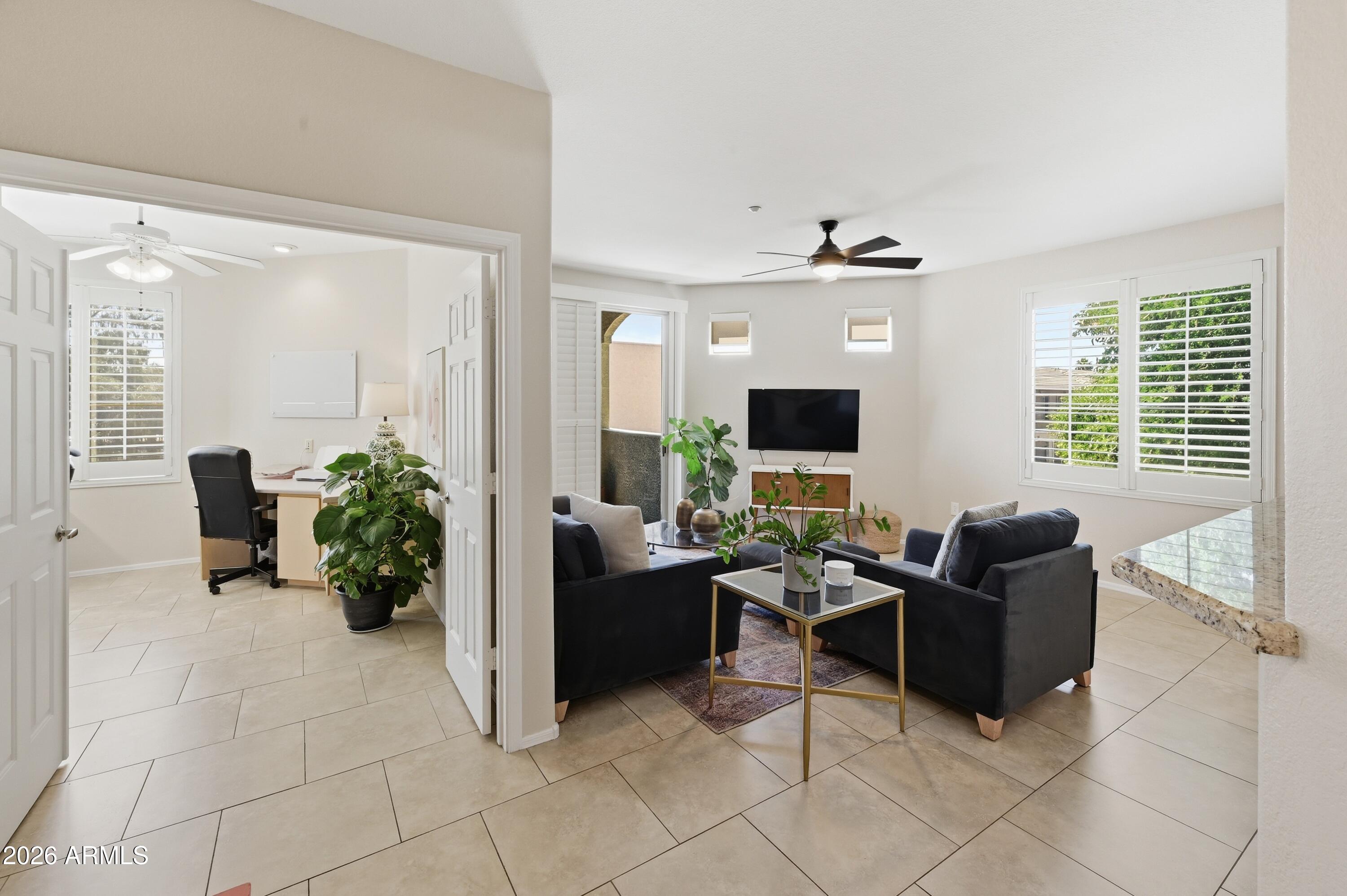 5303 North 7th Street, Unit 220 Phoenix, AZ 85014 - Photo 2 of 33 a living room with furniture and a flat screen tv