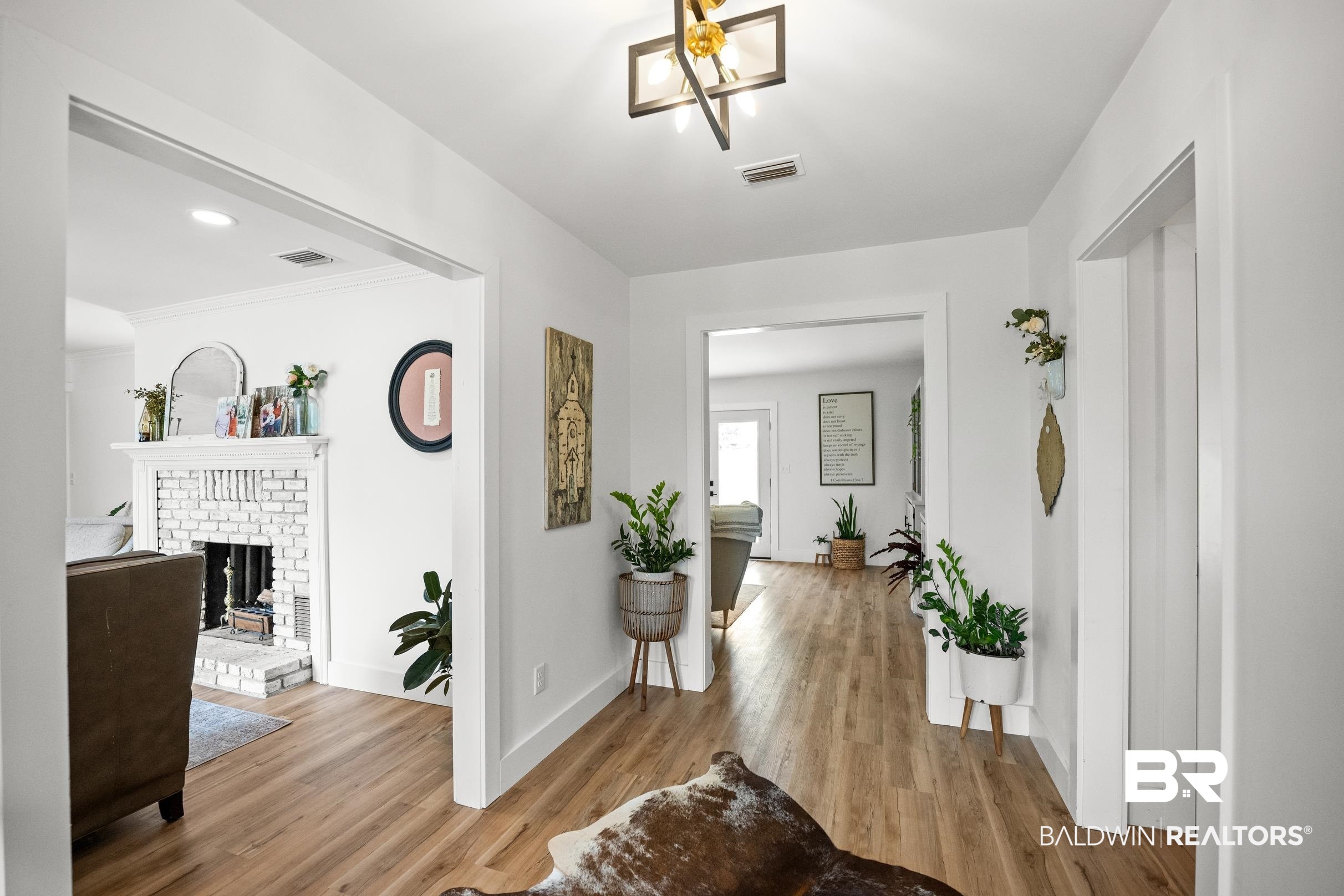 6 Wren Circle Foley, AL 36535 - Photo 4 of 55 Hallway with visible vents, baseboards, and wood finished floors