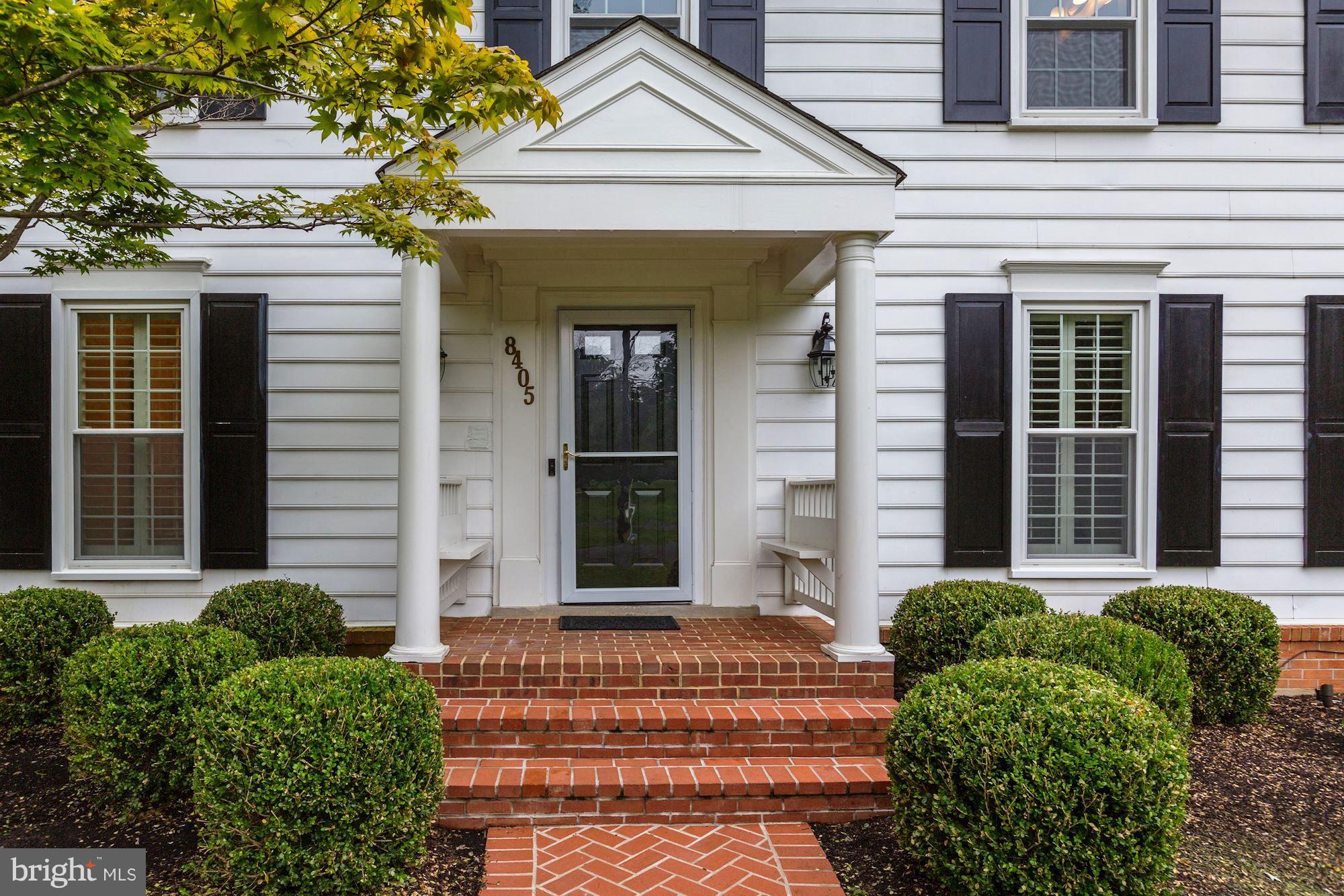 8405 Kingsgate Road Potomac, MD 20854 - Photo 2 of 30 a front view of a house with a garden