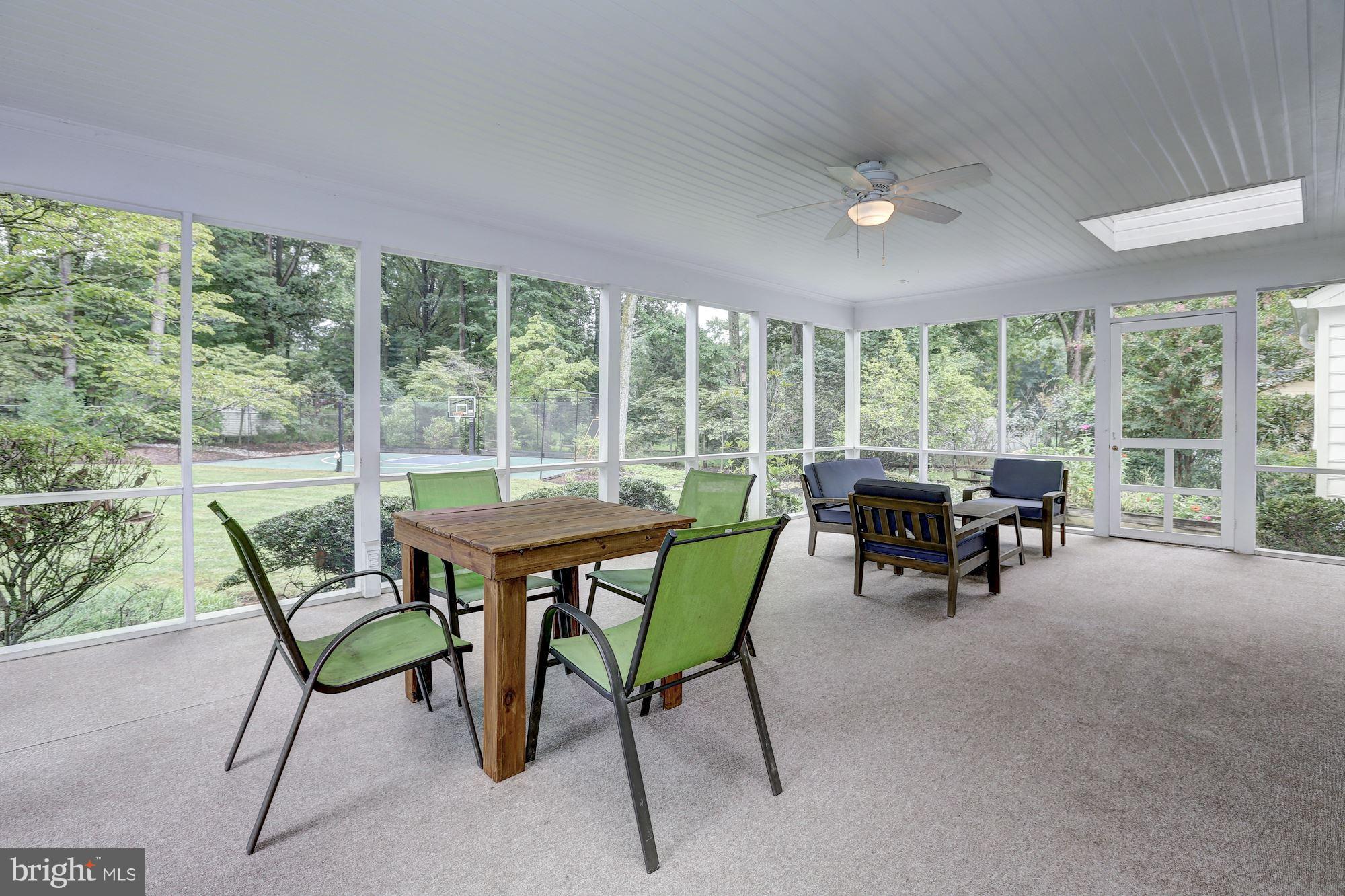 8405 Kingsgate Road Potomac, MD 20854 - Photo 11 of 30 a dining room with furniture and a floor to ceiling window