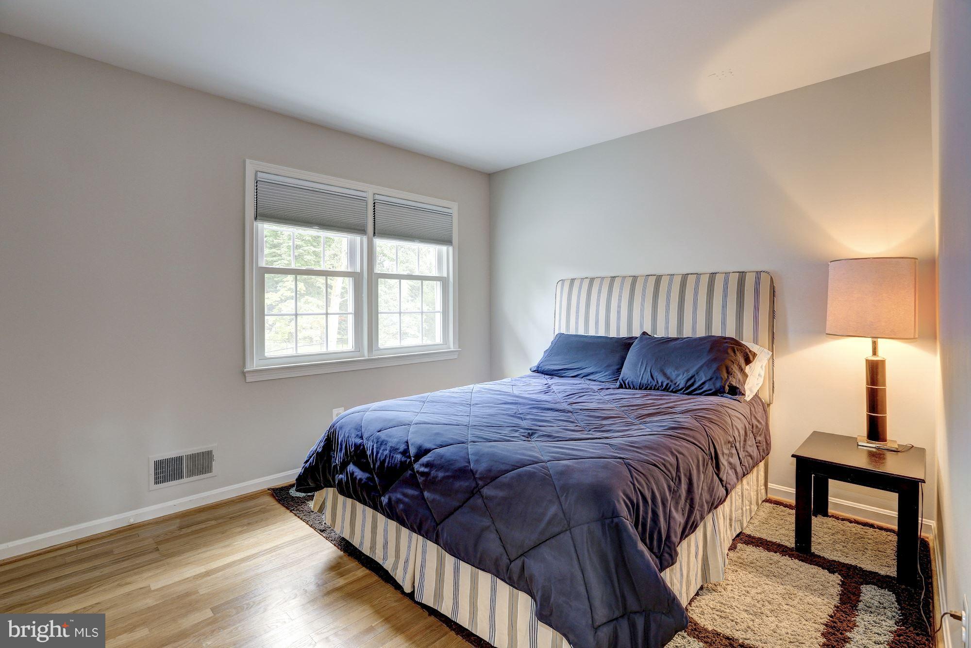 8405 Kingsgate Road Potomac, MD 20854 - Photo 27 of 30 a bedroom with a bed and a window