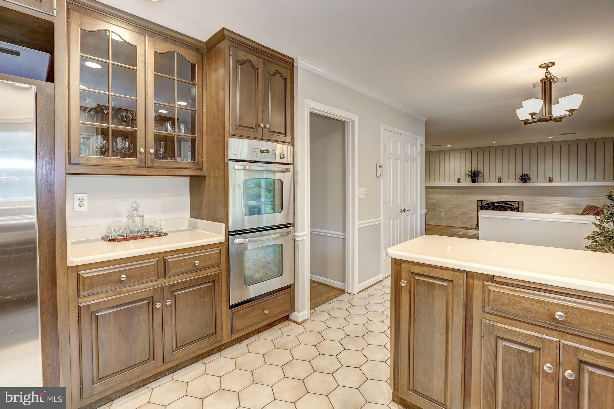 8405 Kingsgate Road Potomac, MD 20854 - Photo 6 of 30 a kitchen with cabinets and window