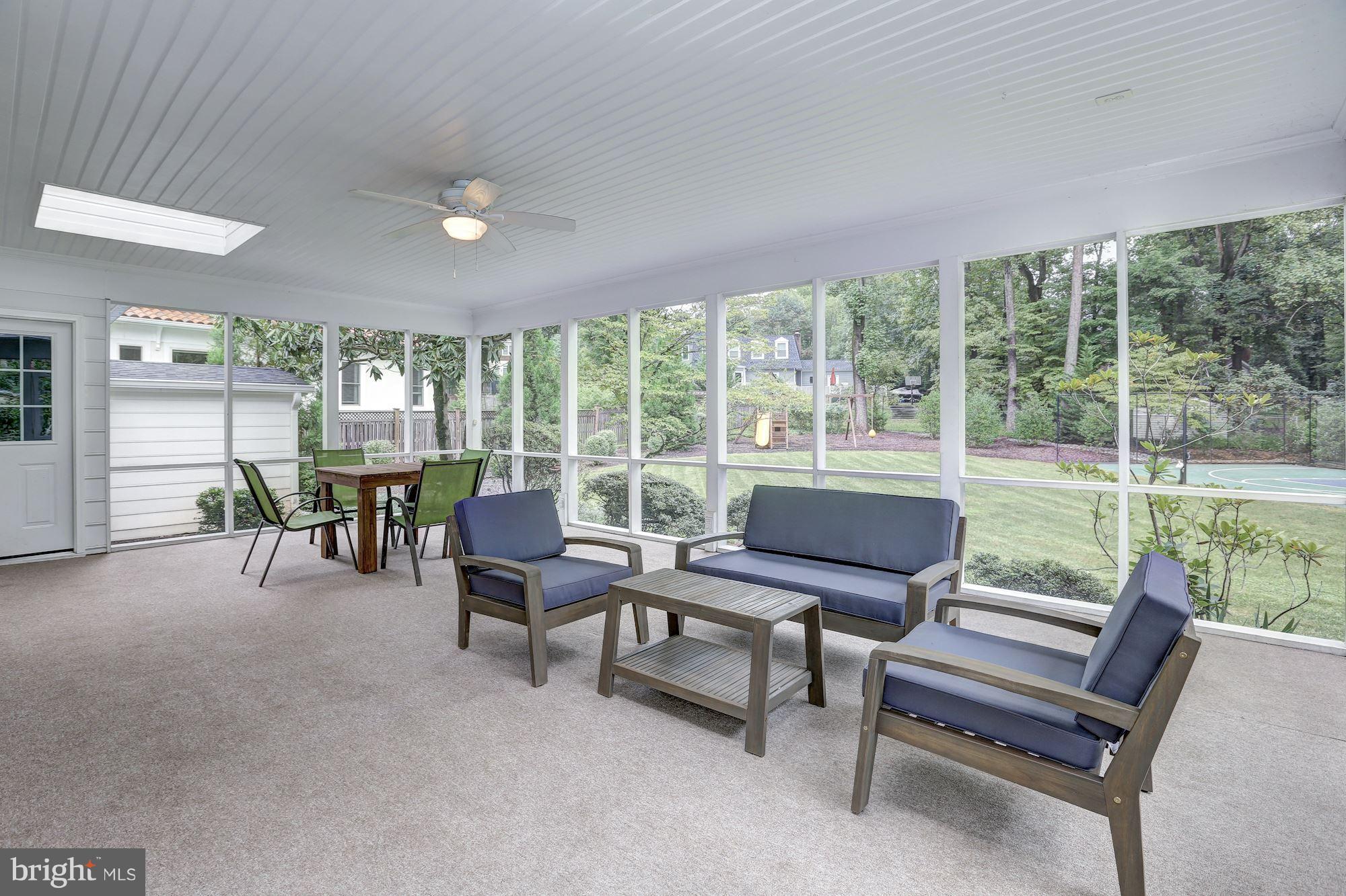 8405 Kingsgate Road Potomac, MD 20854 - Photo 10 of 30 a living room with furniture and a floor to ceiling window