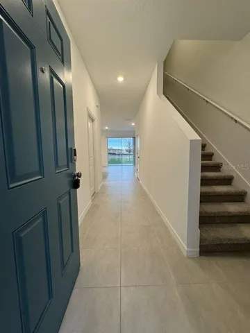 a view of hallway with stairs