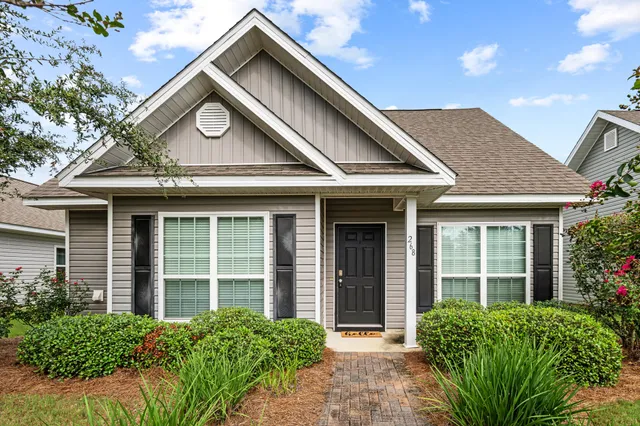 front view of a house with a garden