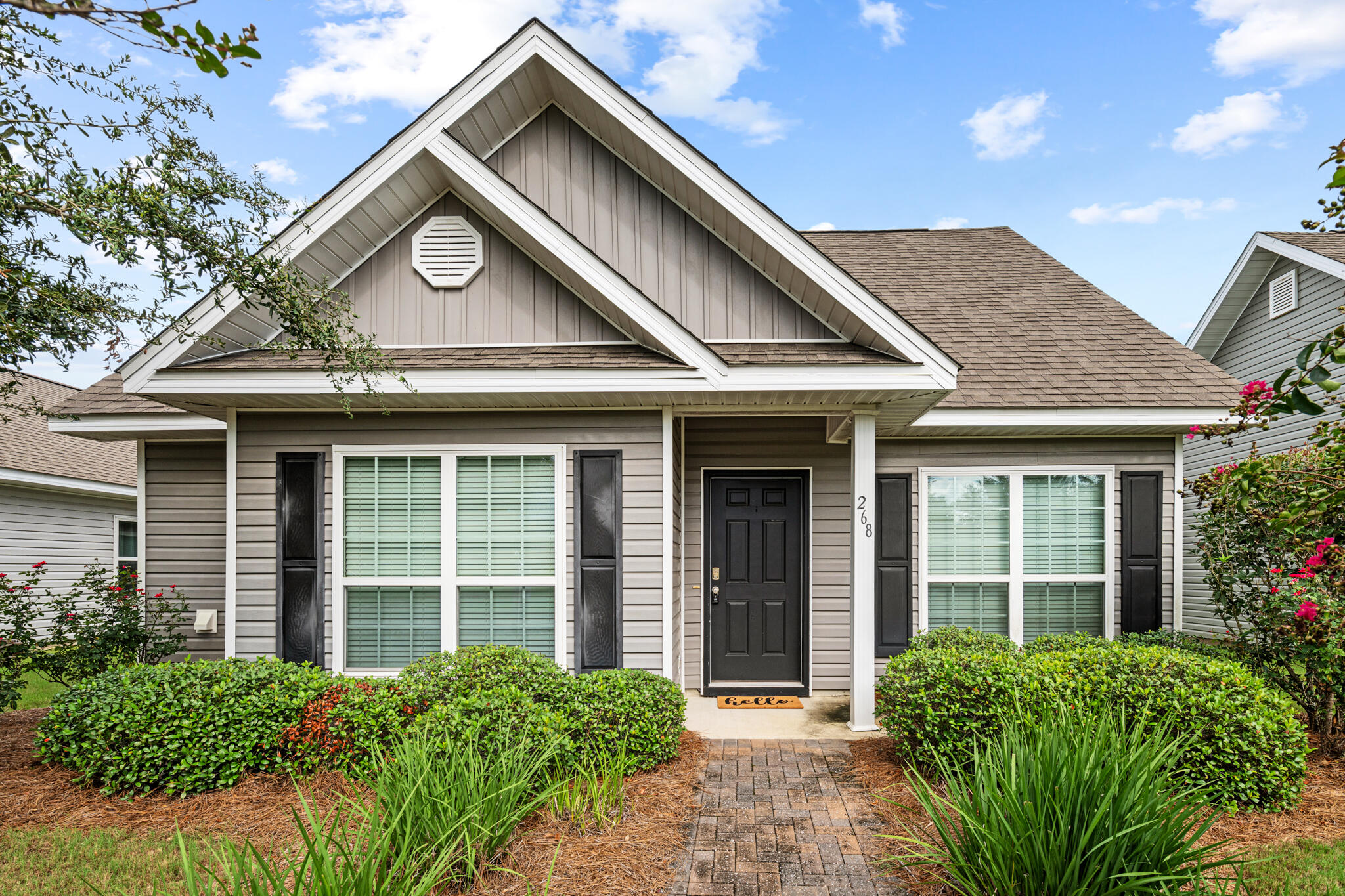 268 Cornelia Street Freeport, FL 32439 - Photo 1 of 41 front view of a house with a garden