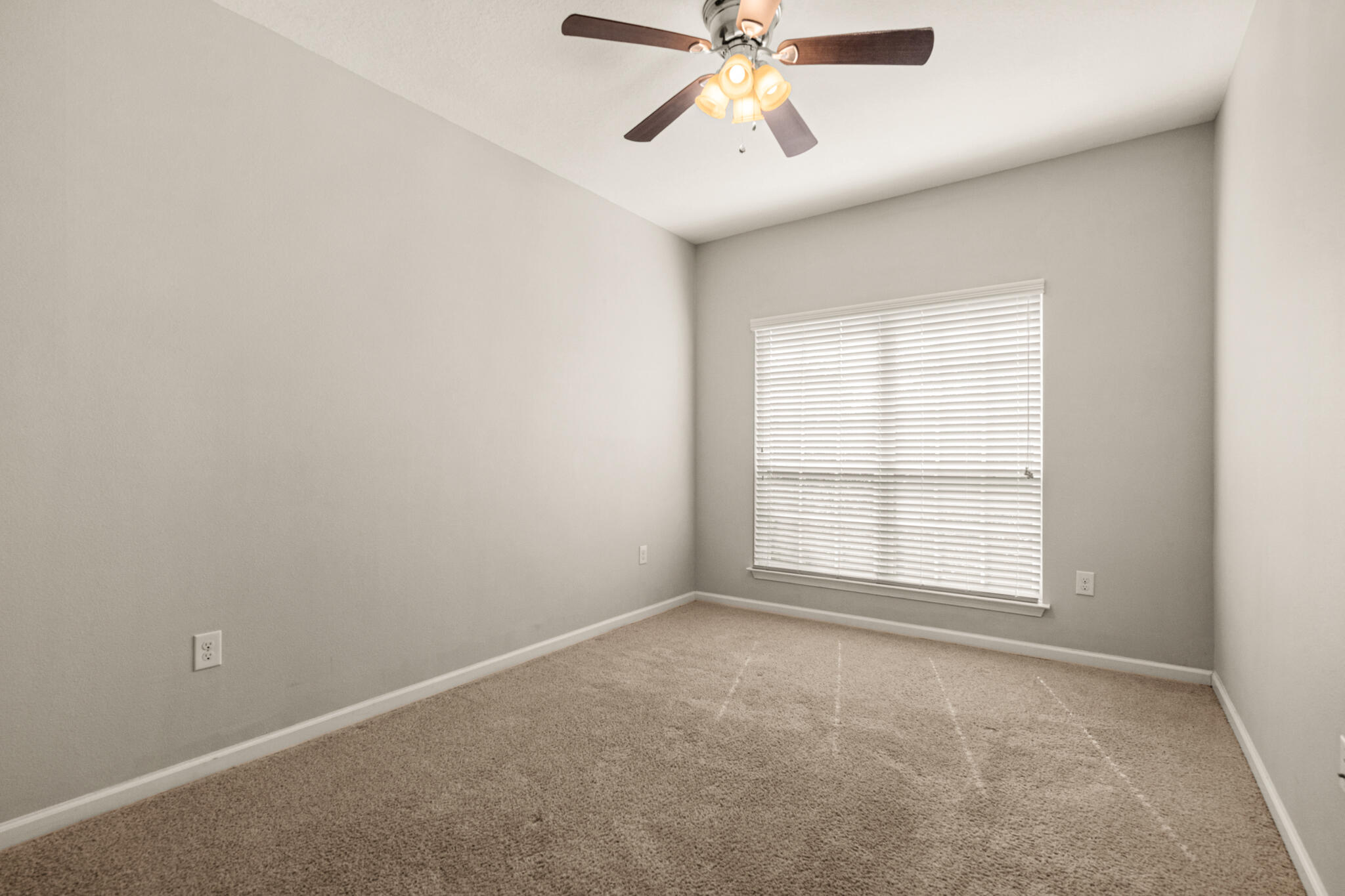 268 Cornelia Street Freeport, FL 32439 - Photo 26 of 41 an empty room with a window and a fan