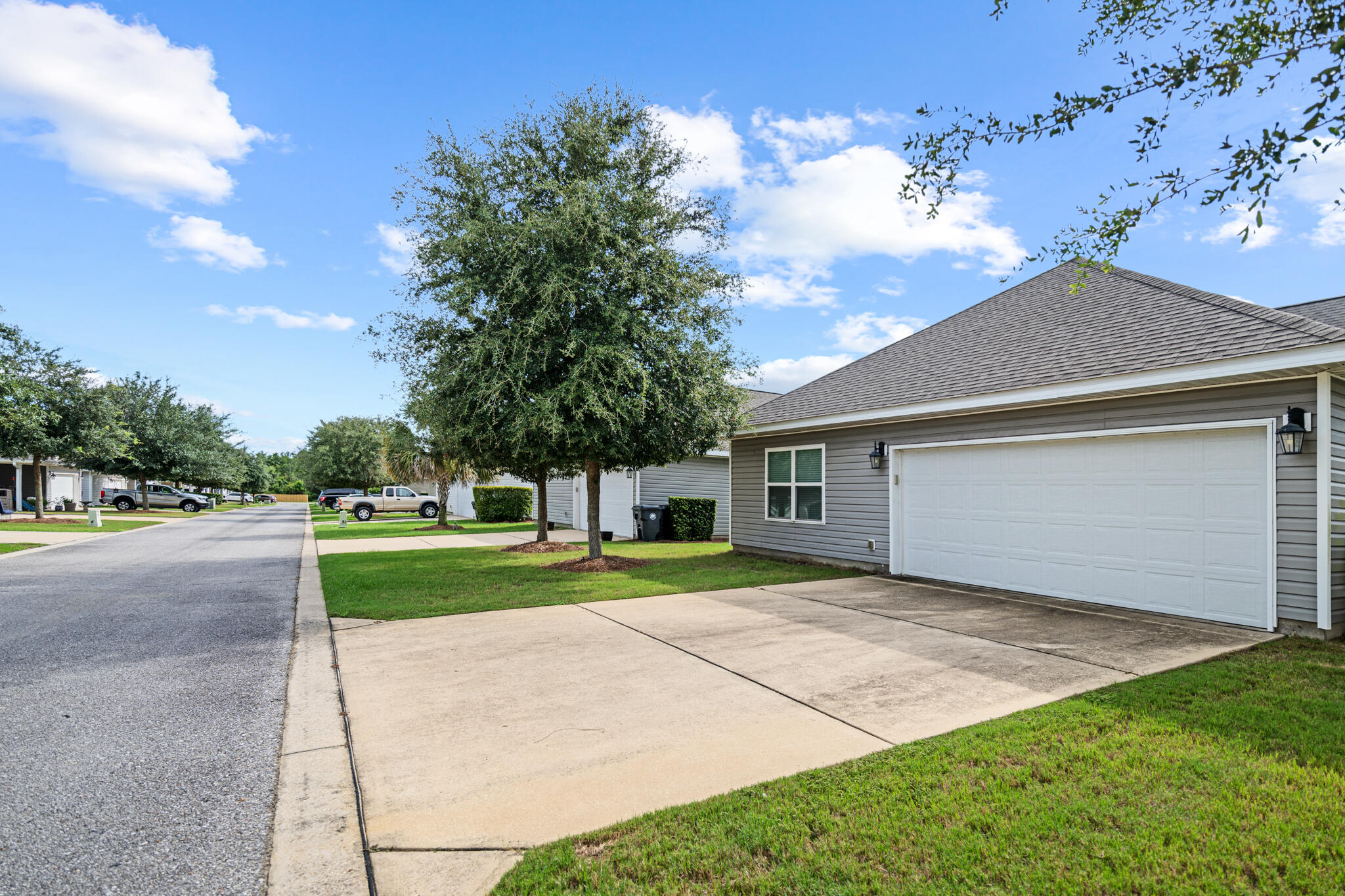 268 Cornelia Street Freeport, FL 32439 - Photo 32 of 41 a front view of a house with a yard and garage