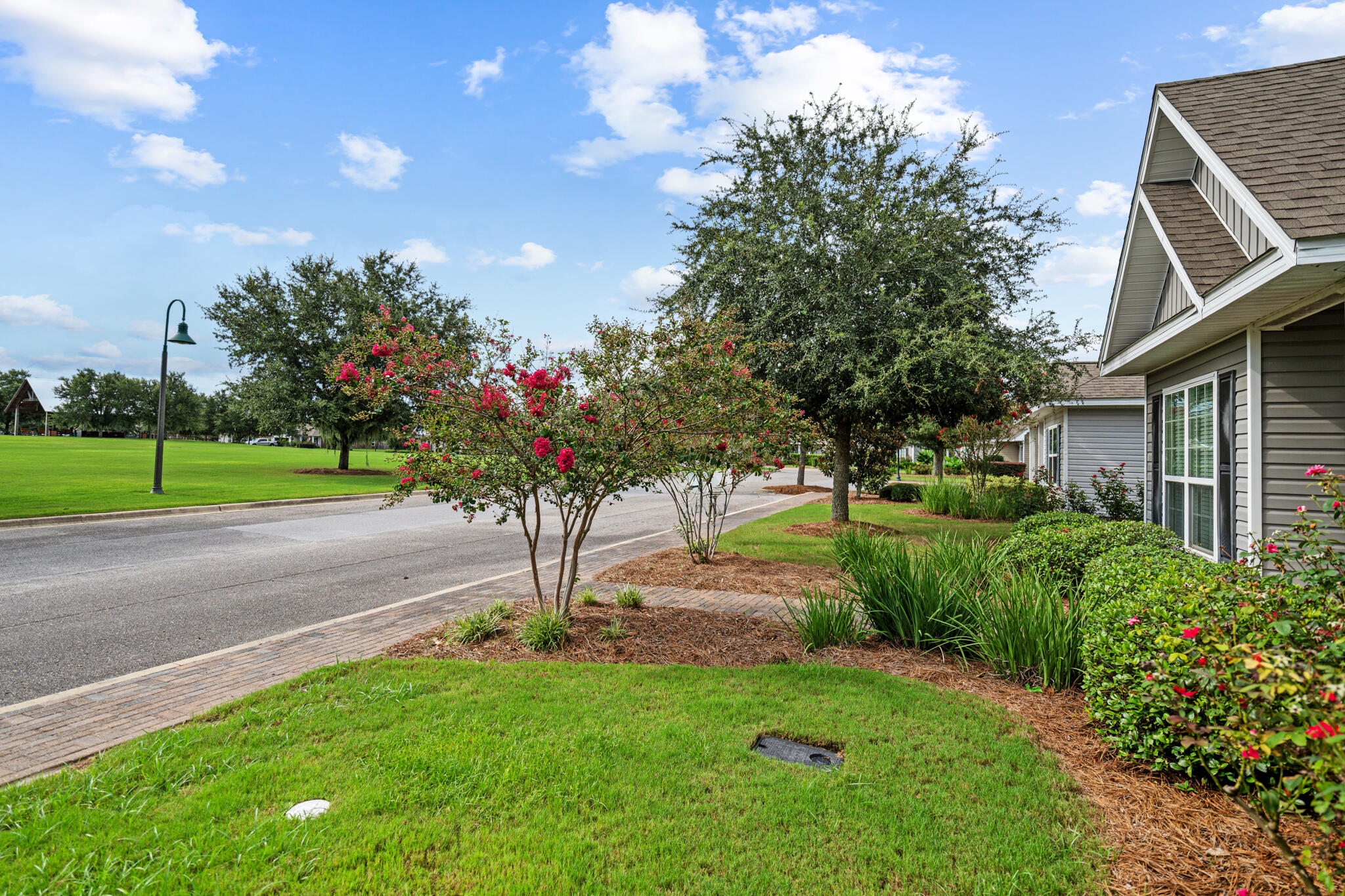 268 Cornelia Street Freeport, FL 32439 - Photo 34 of 41 a view of a garden with a fountain