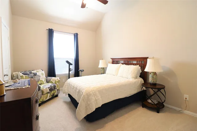 a bedroom with a bed and a mirror