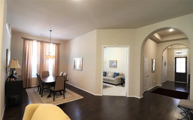 a view of a livingroom with furniture window and wooden floor