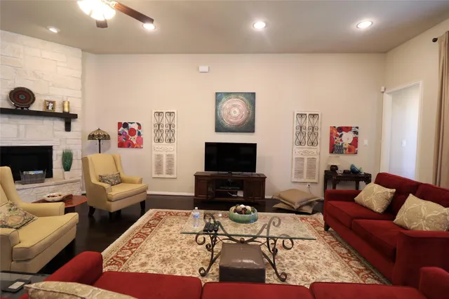 a living room with furniture and a fireplace