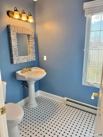 a front view of a house with a big yard