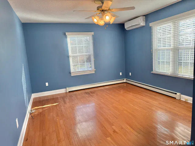 a bathroom with a sink toilet and mirror
