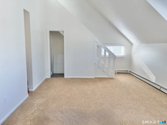 a bathroom with a granite countertop sink a mirror and a shower